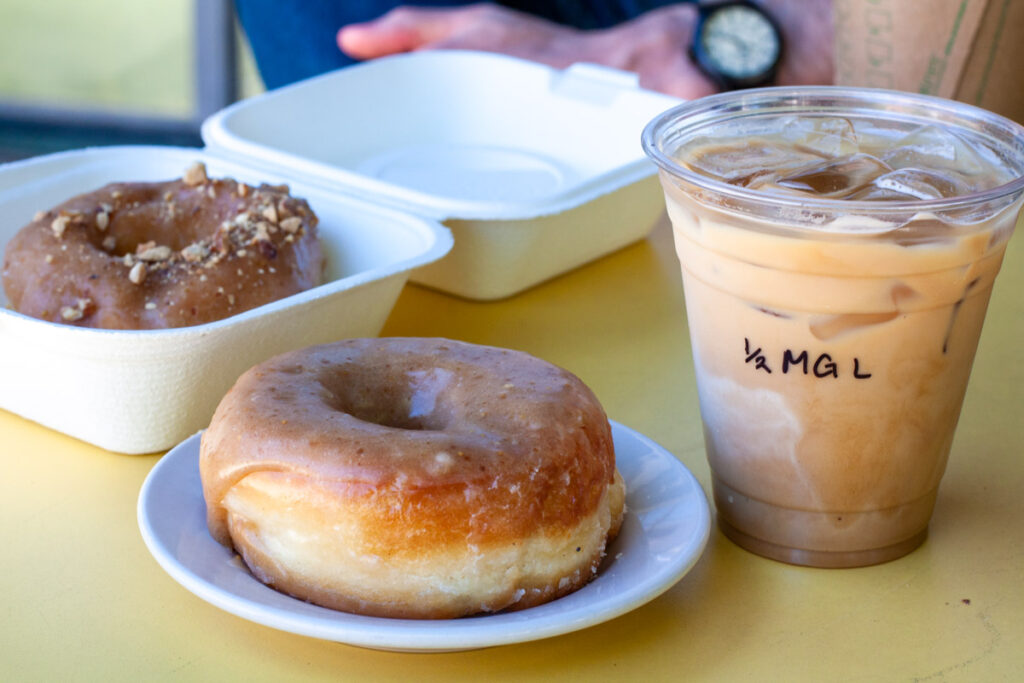 Doughnuts and coffee on a table.