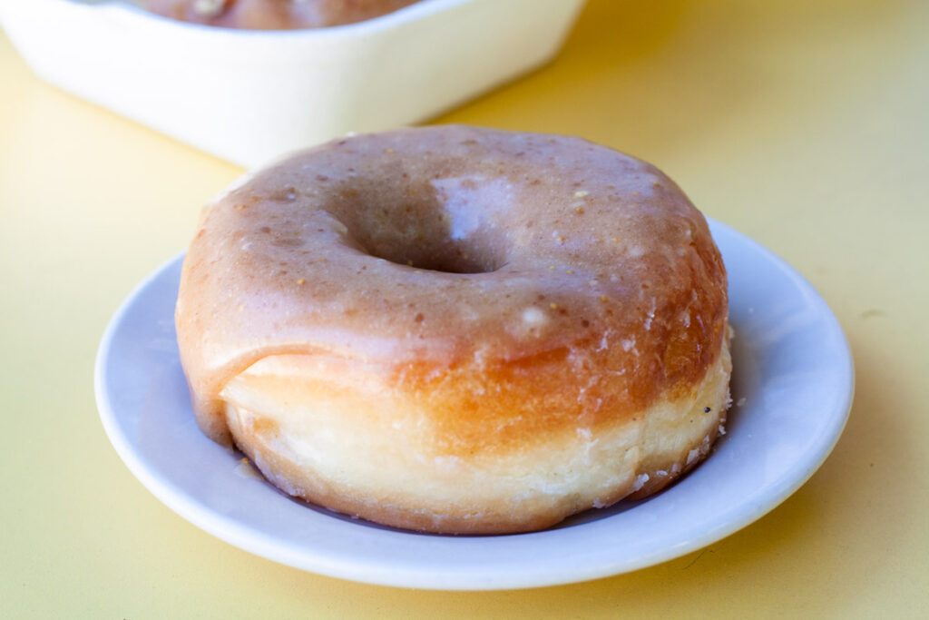 A doughnut on a table.